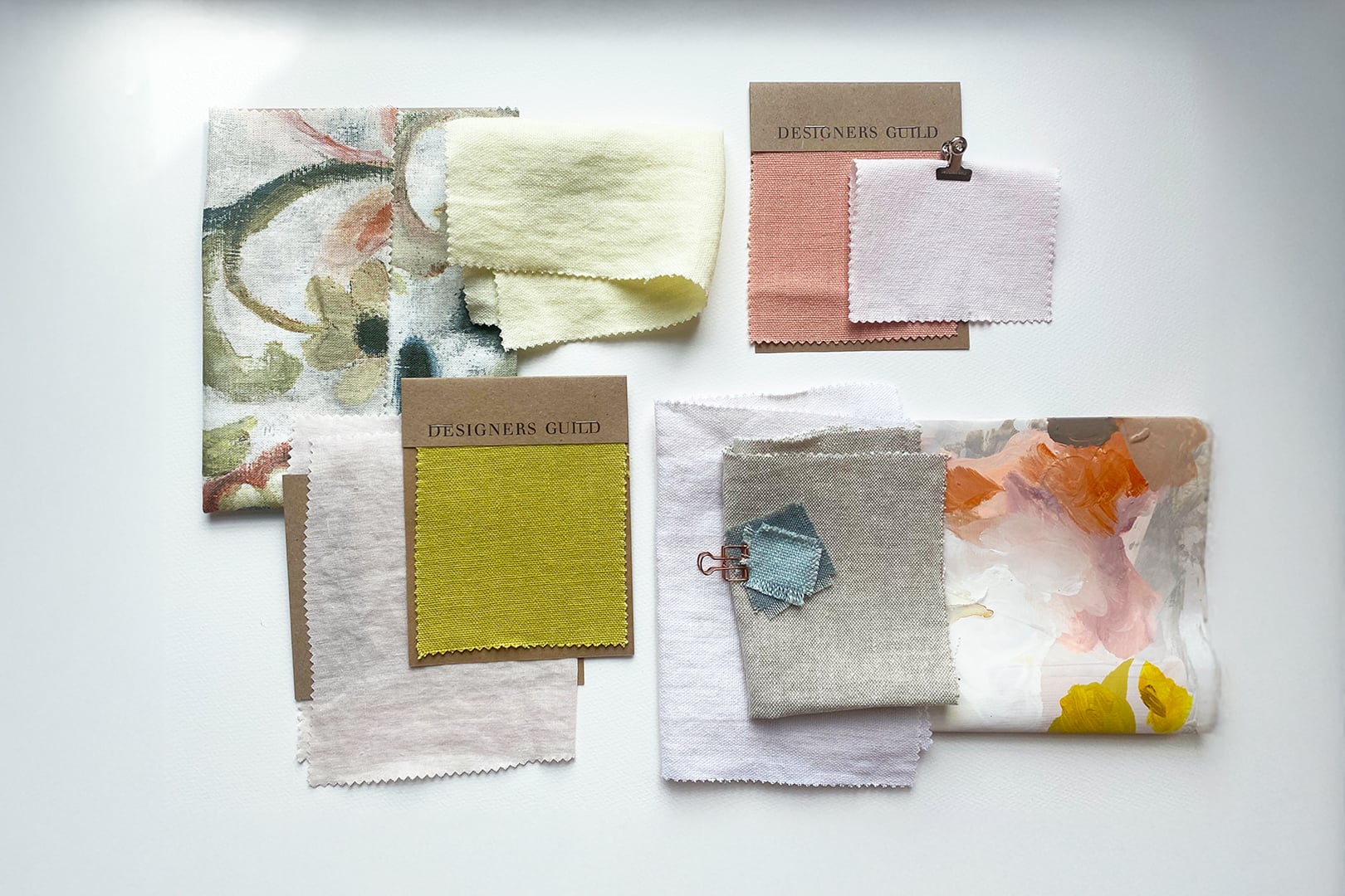 Spring linen moodboard featuring chalky swatches in soft pink, apricot, yellow and neutral tones