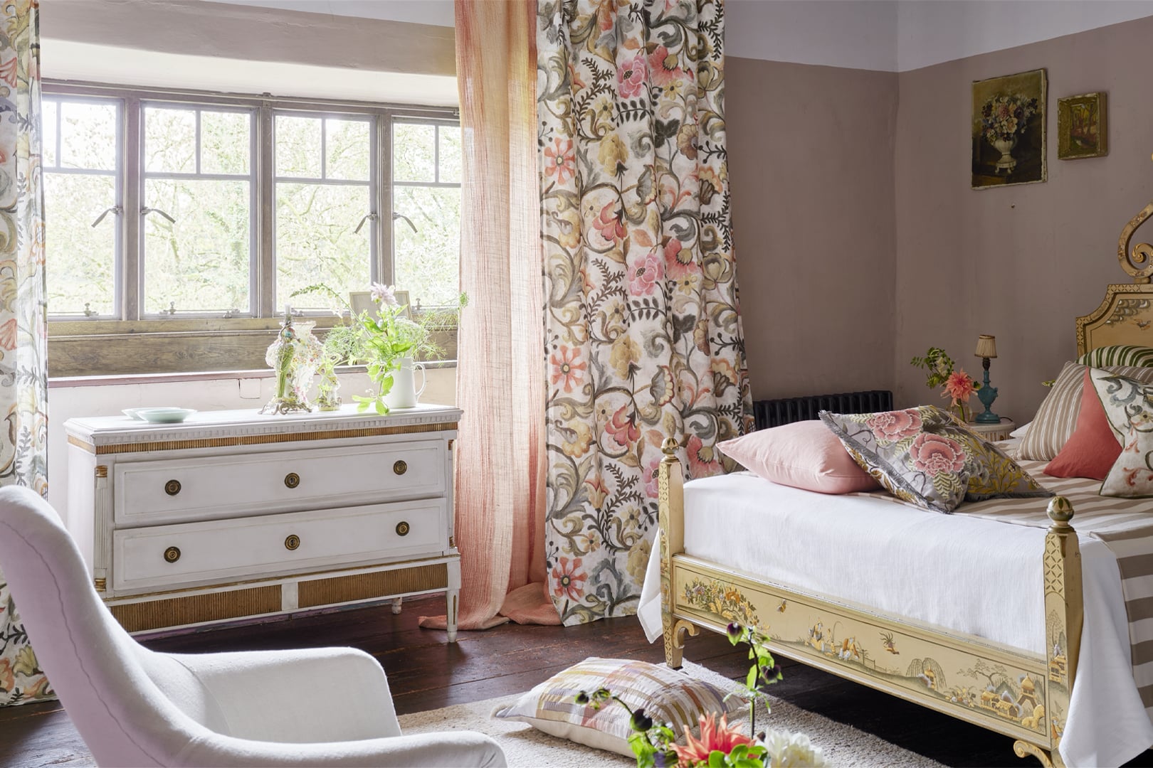 Room with Brera Lino curtains in soft chalky tones framing the window and bed