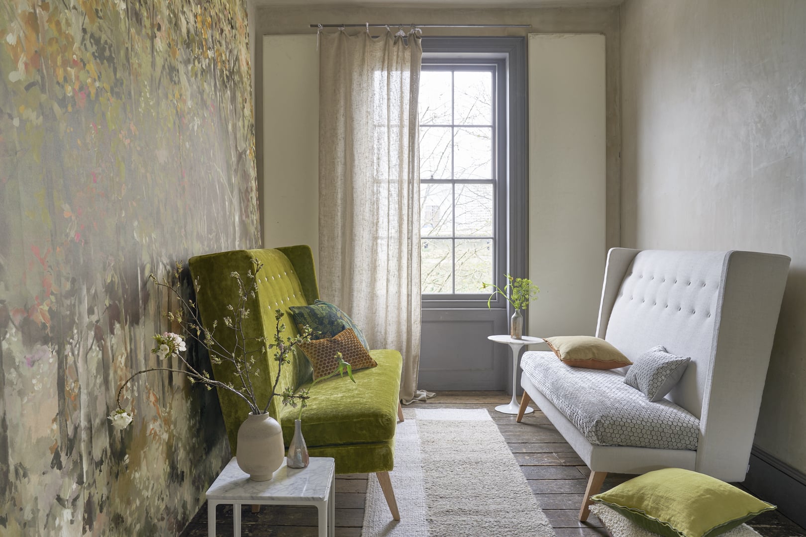Interior featuring a scenic wallpaper panel used as a statement wall