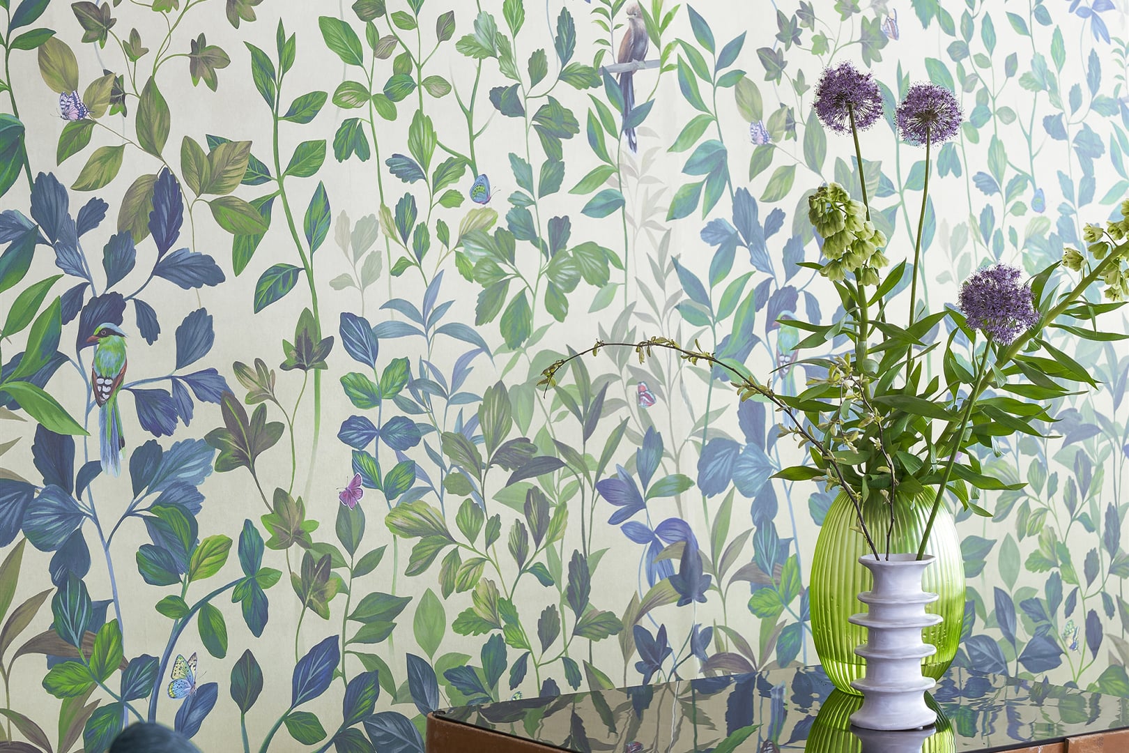 Bird and animal print wallpaper with leafy botanical pattern and purple vase