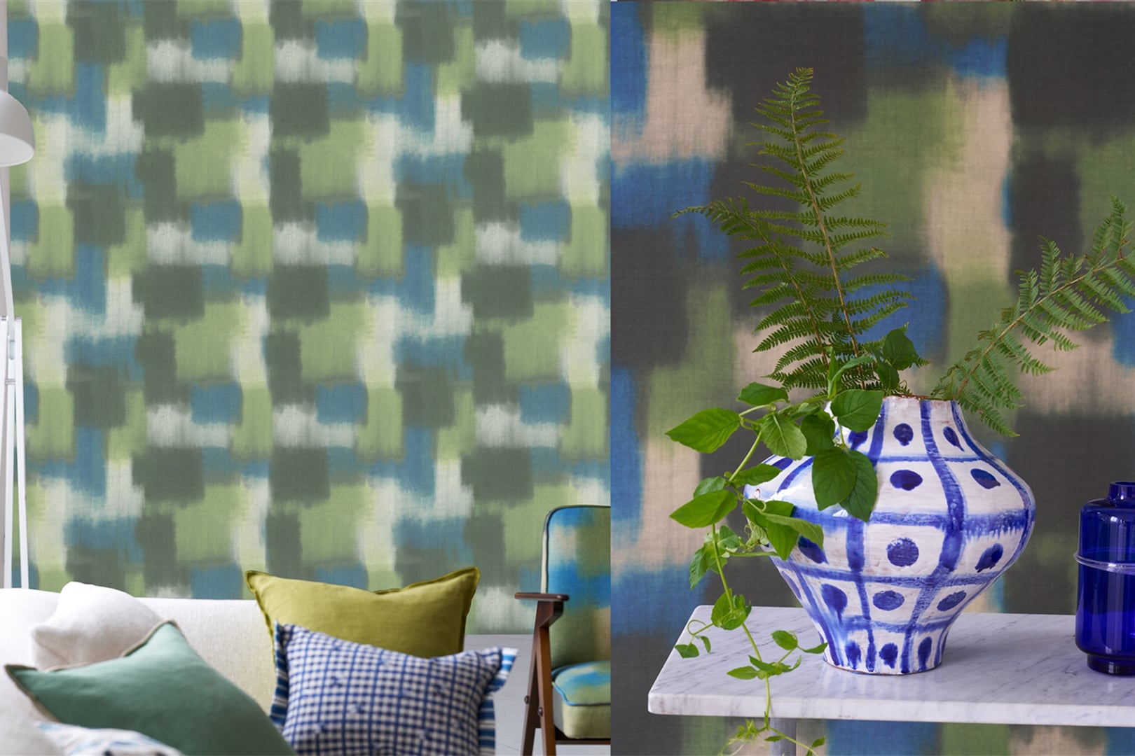 Close-up of green and blue geometric wallpaper with decorative vase and plant in foreground