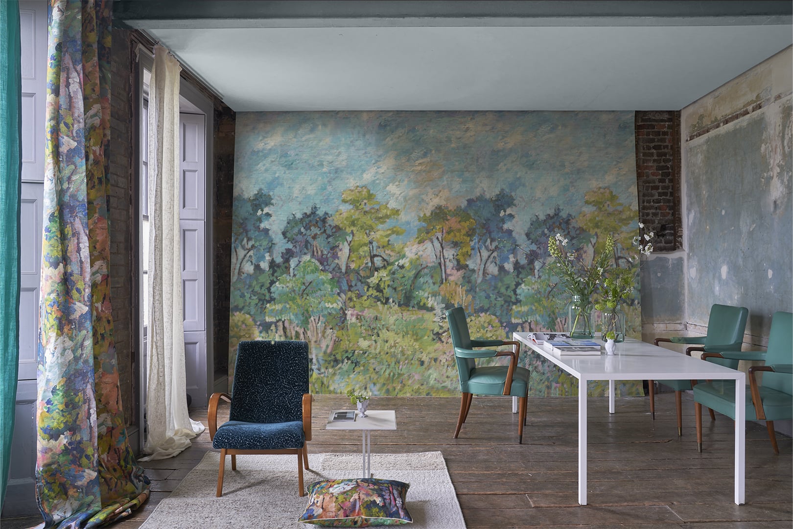 Interior with large scenic wallpaper mural creating an atmospheric landscape backdrop