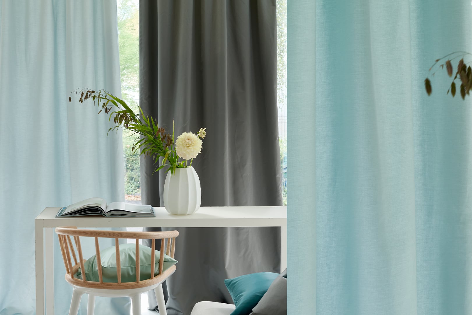 Contemporary interior with Tiber Eco silk and taffeta fabric by Designers Guild in soft aqua and grey tones