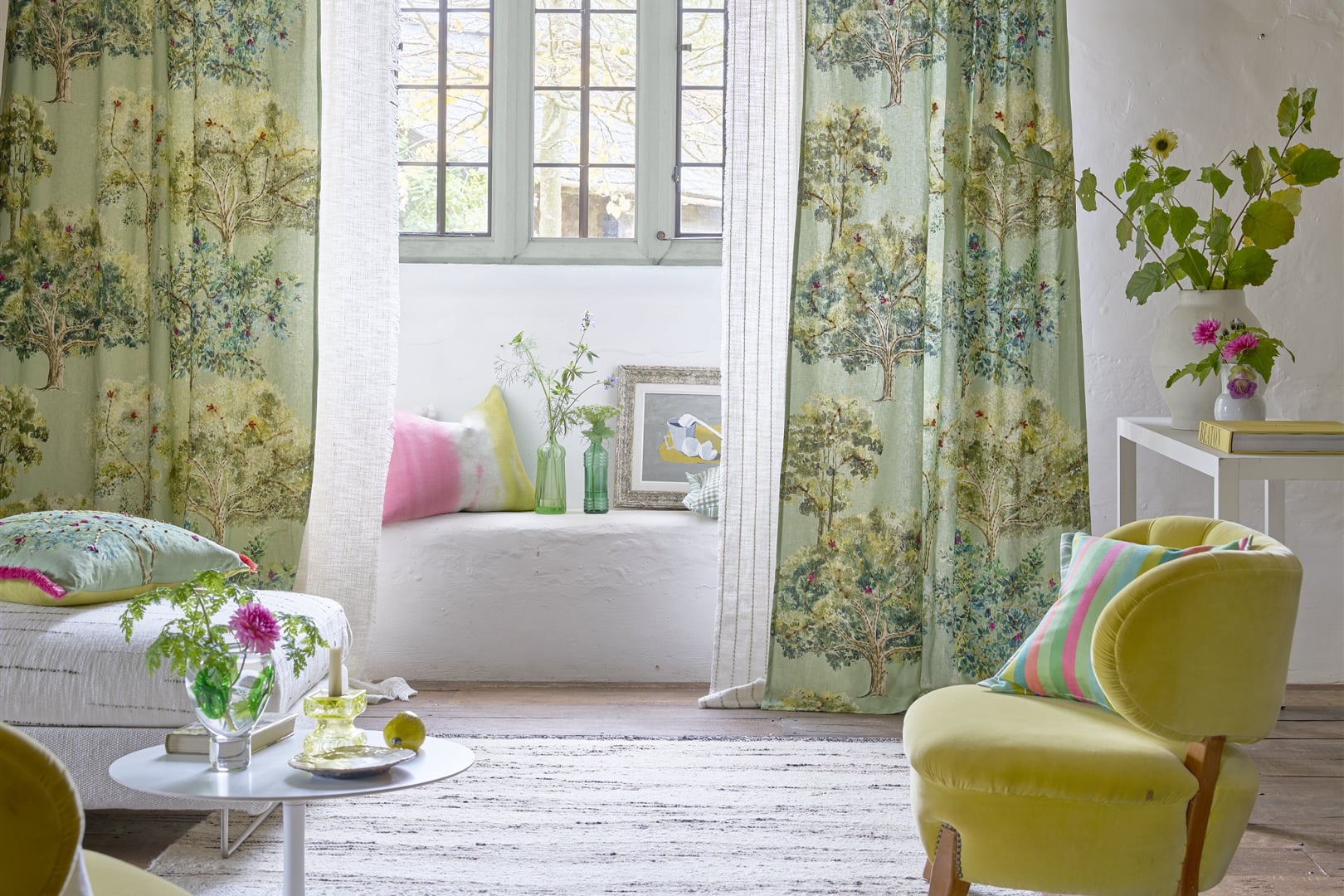 Bosquet Sauvage room scene with embroidered forest curtains in soft green tones